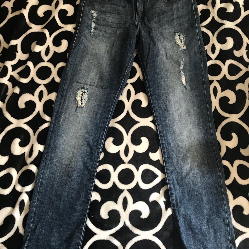 Distressed blue jeans